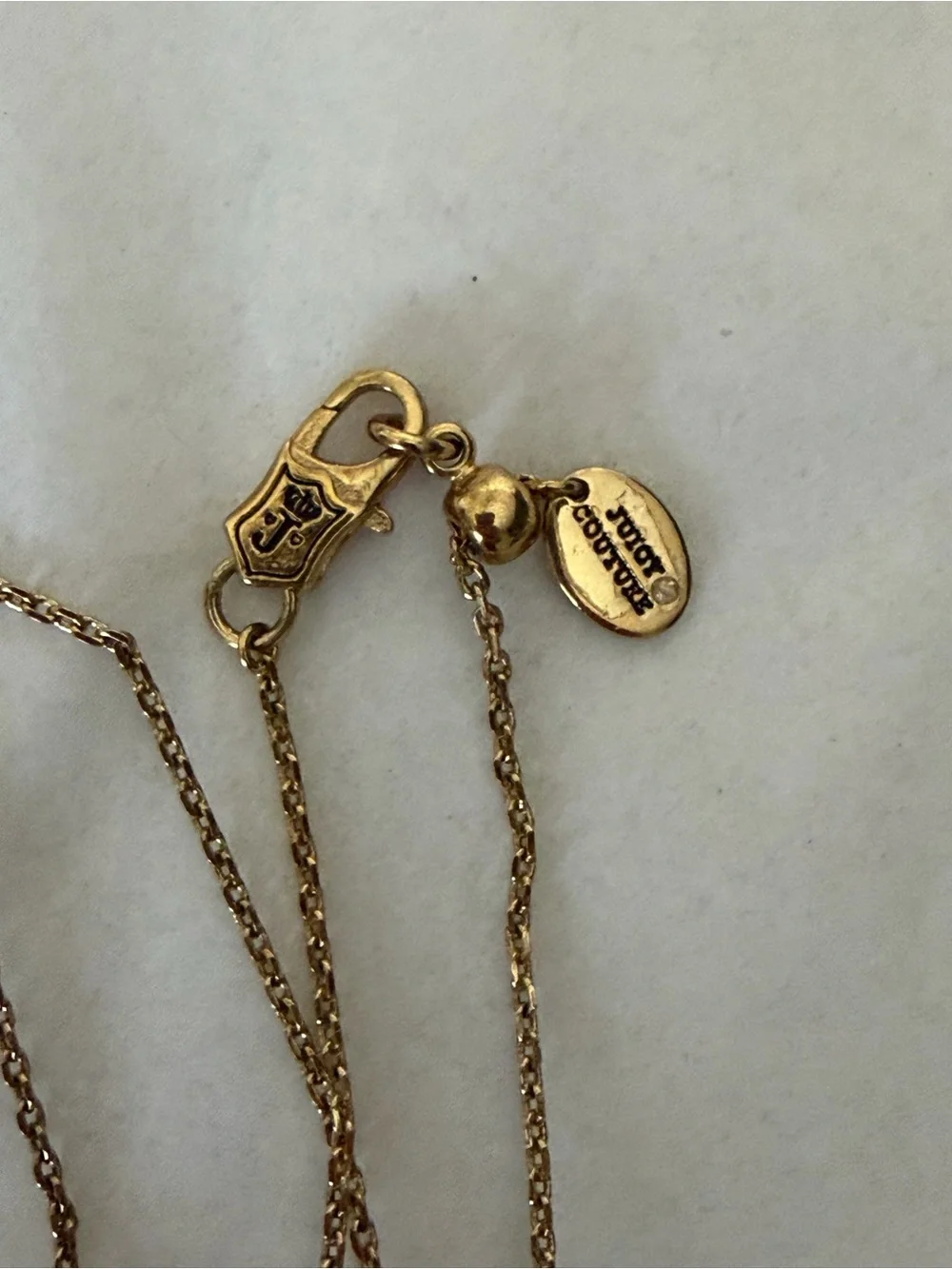 Juicy Couture gold tone